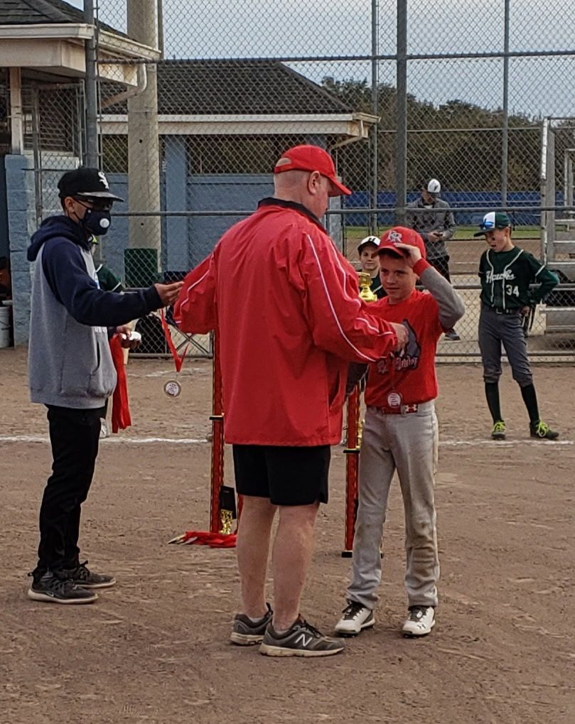 Coach Rick presenting awards after a tournament