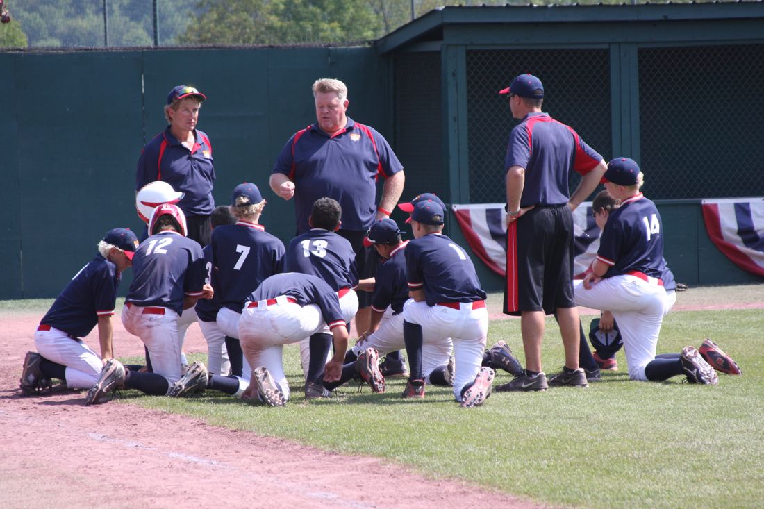 Coach Rick talking to his team after a game
